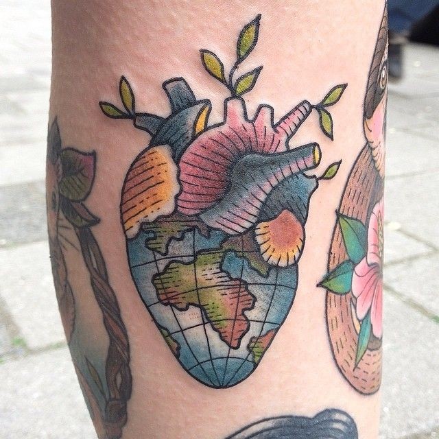 Little colored heart shaped globe tattoo stylized with leaves