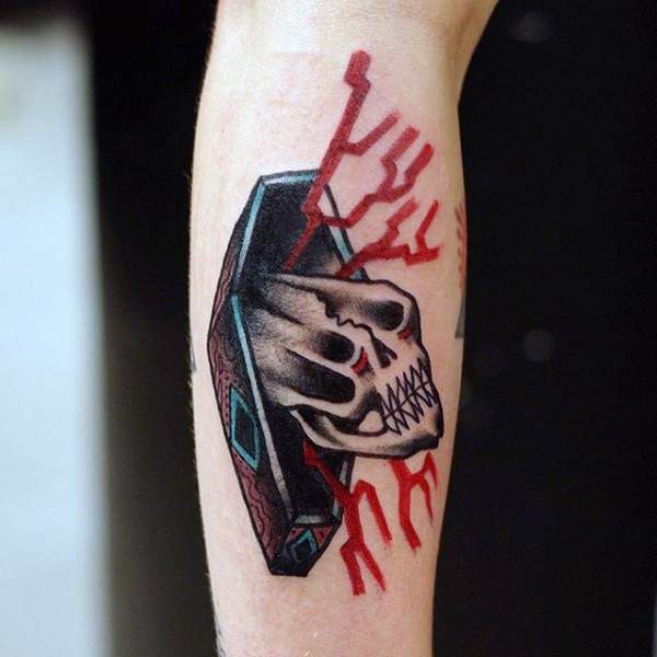 Little colored mystic coffin with corrupted skull tattoo on arm