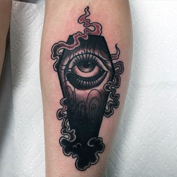 Little colored mystical coffin  in fog tattoo on leg