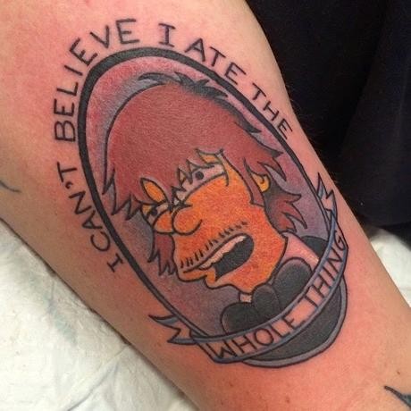 Little colored Simpsons cartoon hero portrait tattoo stylized with lettering