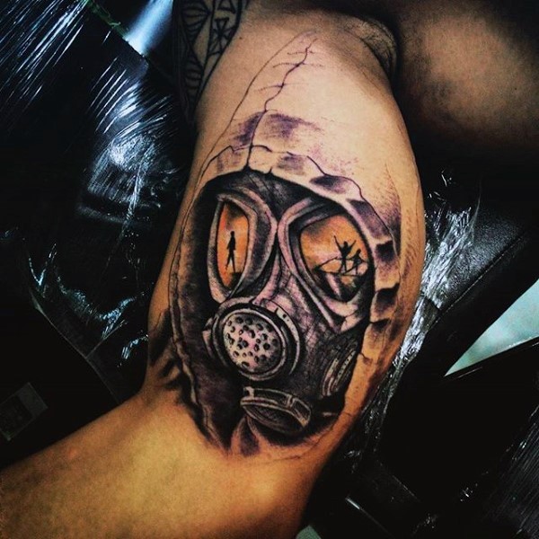 Little colorful mystic man in gas mask tattoo on arm