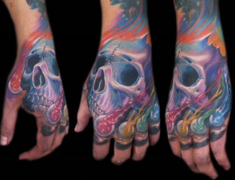 Little cute colored hand tattoo of futuristic skull and lite jellyfishes