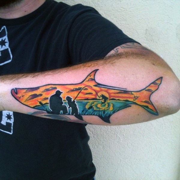 Little fish shaped tattoo stylized with fishing family tattoo on leg
