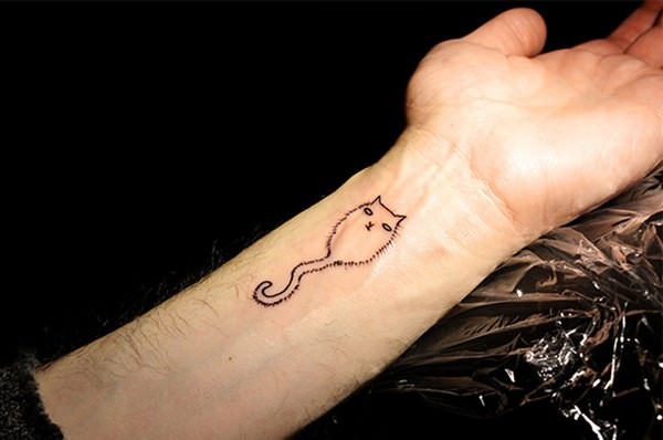 Little ghost like wrist tattoo of cute cat