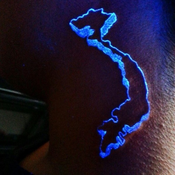 Little glowing ink painted map part tattoo on arm