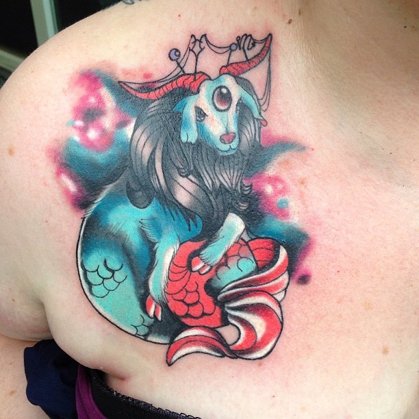 Little multicolored fantasy goat tattoo on chest