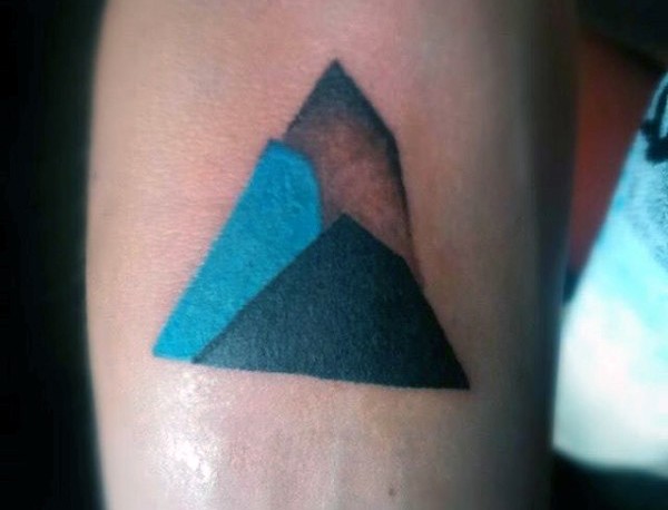 Little multicolored geometrical tattoo on arm