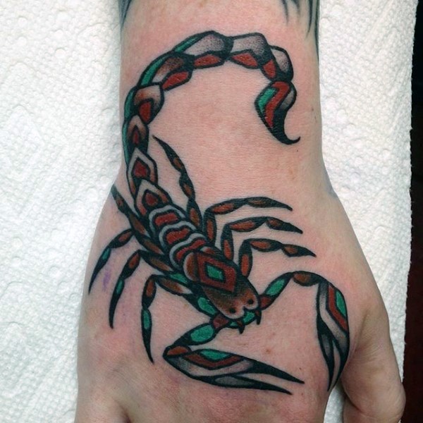 Little multicolored old school scorpion tattoo on hand