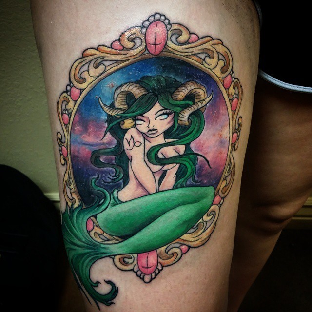 Little multicolored seductive woman Capricorn tattoo on thigh