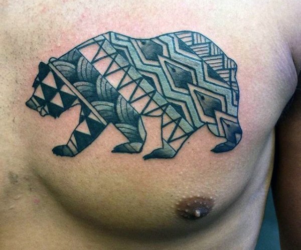 Little multicolored tribal style painted bear tattoo on chest