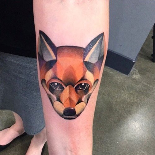Little natural colored forearm tattoo of geometrical fox
