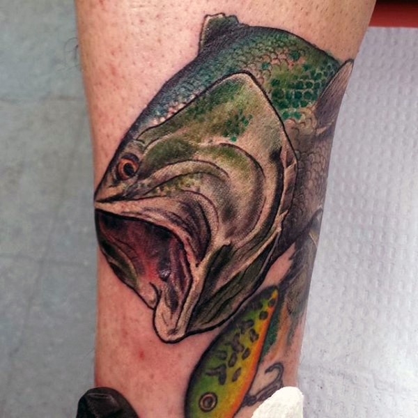 Little natural looking colorful fish with lure tattoo on leg