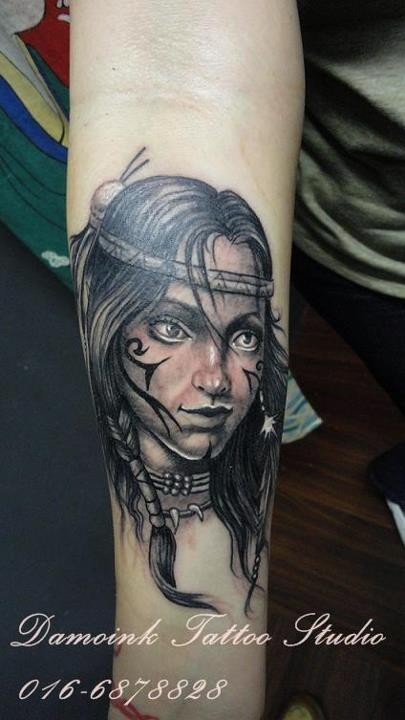 Little nice pained colored forearm tattoo of tribal girl portrait