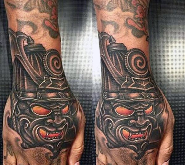 Little original colored samurai mask tattoo on hand
