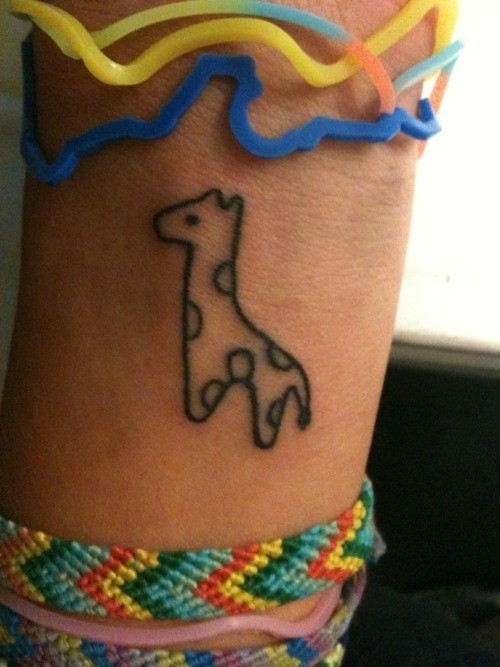 Little pretty giraffe tattoo on wrist