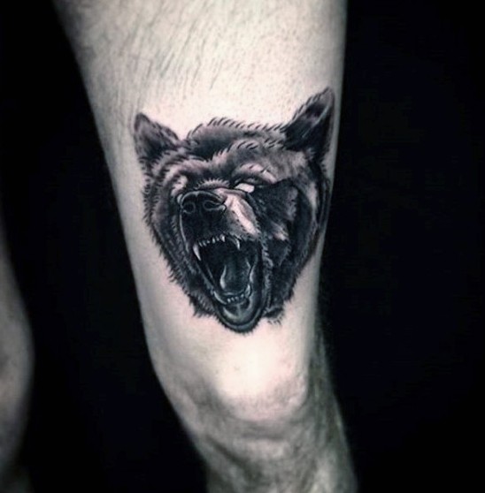 Little realistic looking black and white bear head tattoo on thigh