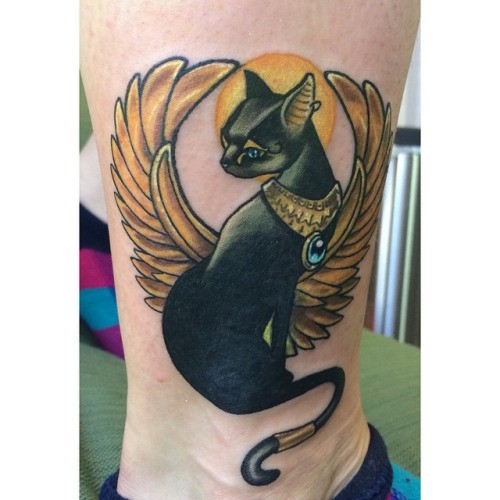 Little wonderful colored Egypt cat with wings tattoo on ankle