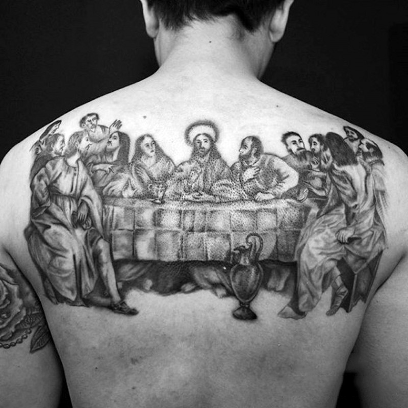 Lord&quots Supper detailed tattoo on upper back