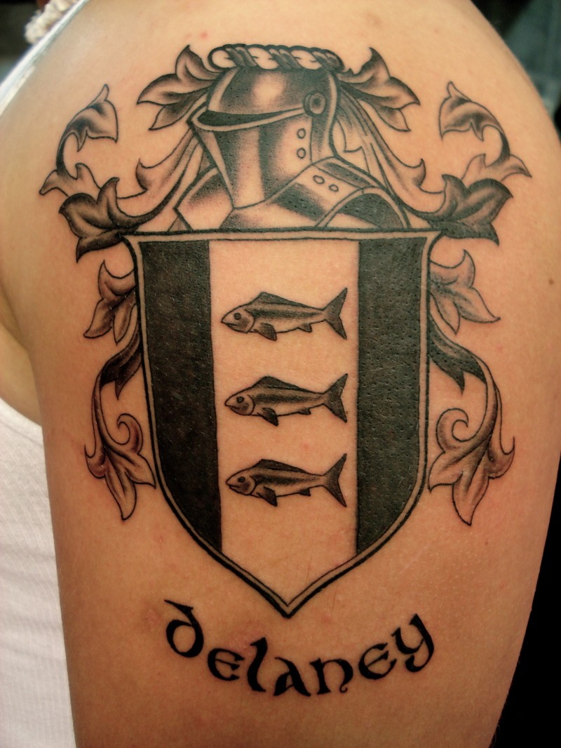 Lovely black gray family crest tattoo on shoulder