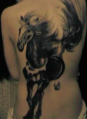 Lovely black ink horse tattoo on back