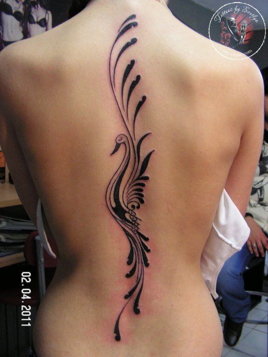 Lovely black tribal phoenix tattoo on back for girls