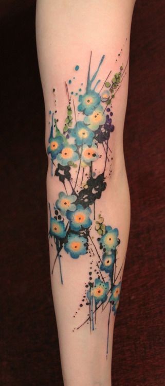 Lovely blue flowers tattoo