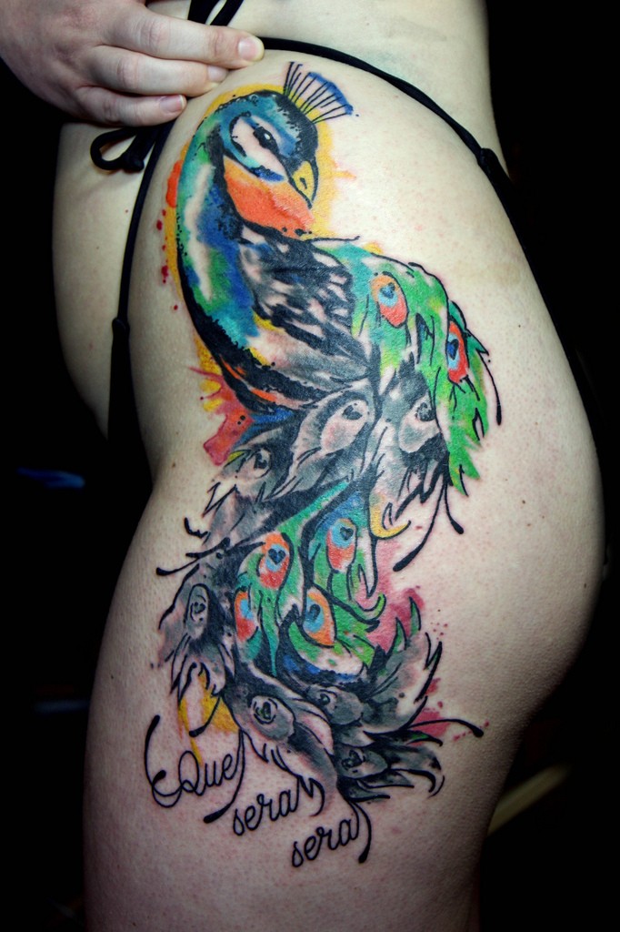 Lovely colorful peacock tattoo on hip