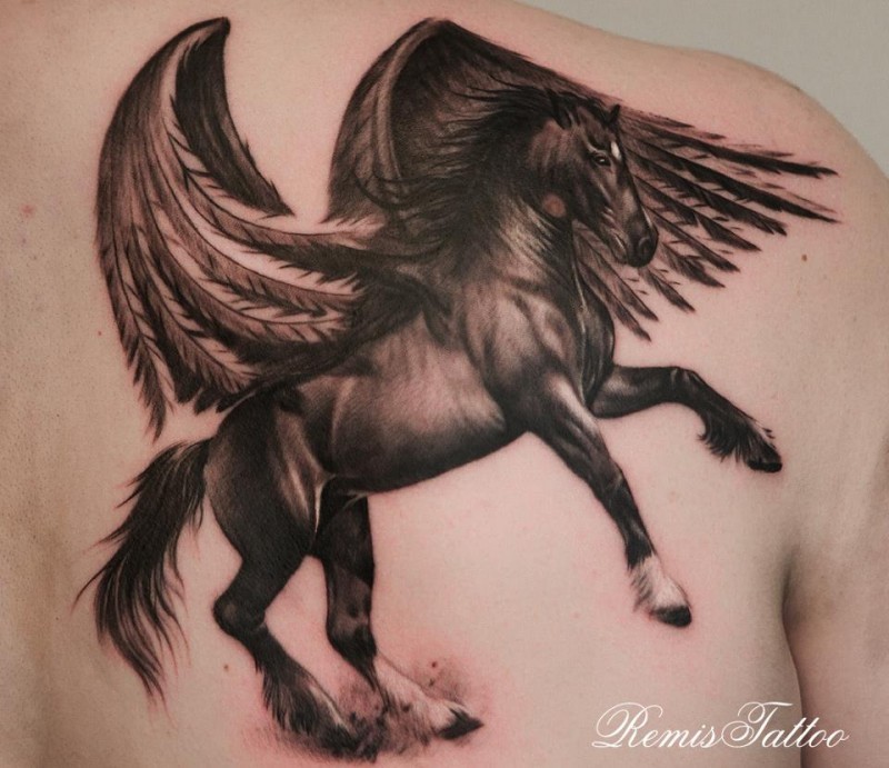 Lovely dark horse with wings tattoo on shoulder blade by remis
