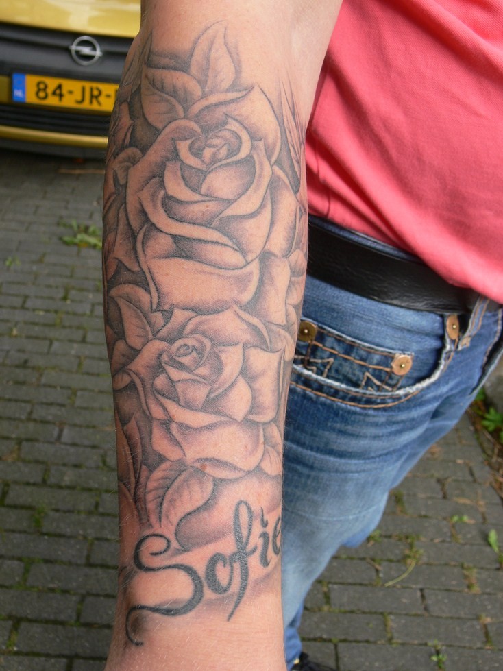 Lovely gray-ink rose flowers tattoo for men on arm