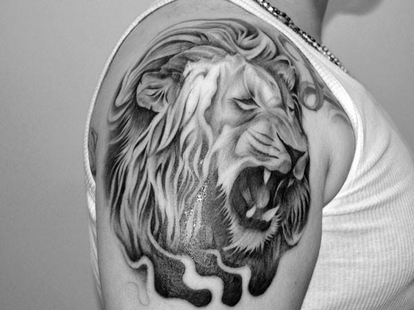 Lovely lion head tattoo on shoulder