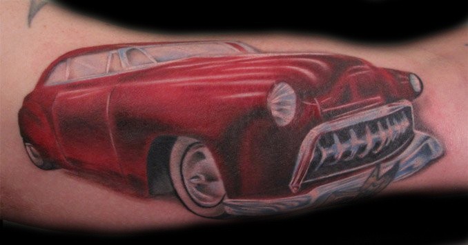 Lovely red car tattoo on arm