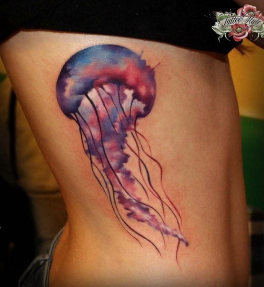 Lovely watercolor jellyfish tattoo on ribs