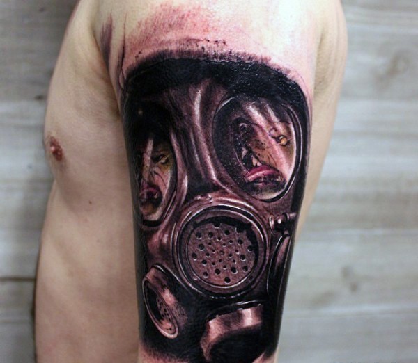 Magnificent black and gray style shoulder tattoo of gas mask