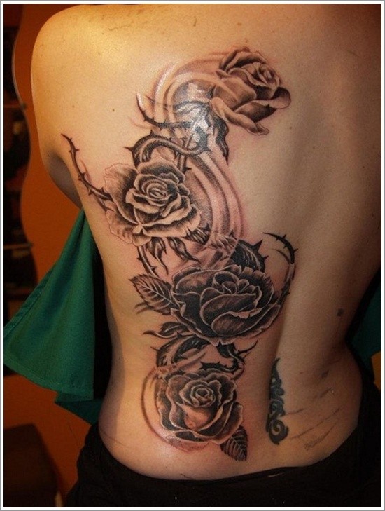 Magnificent black and white big roses tattoo on back