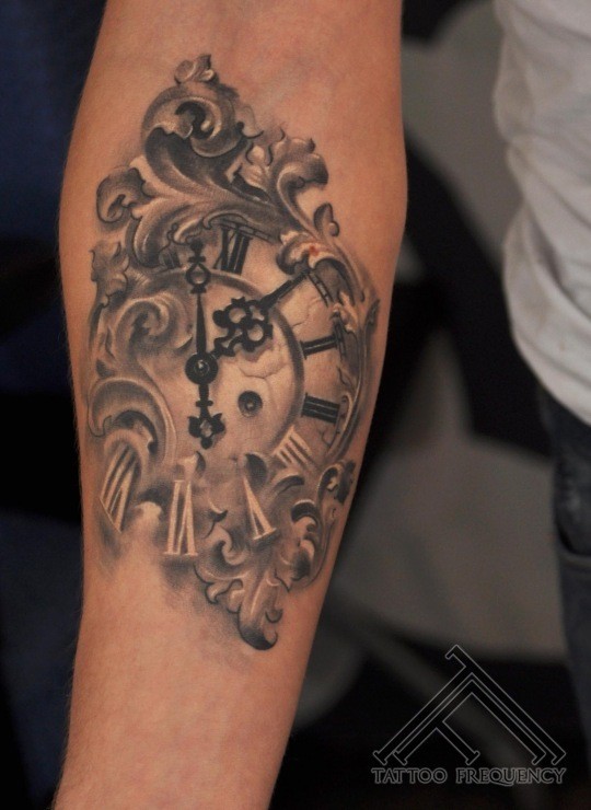 Magnificent black and white old antic clock tattoo on arm
