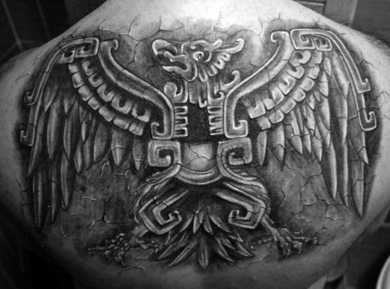 Magnificent black ink 3D like upper back tattoo of ancient wall sculpture