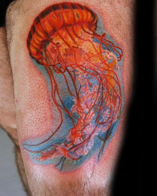 Magnificent colorful jellyfish tattoo on thigh