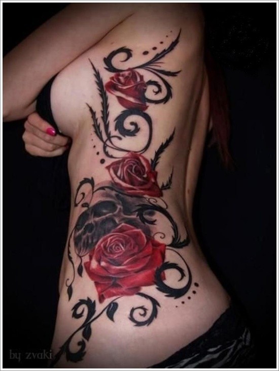 Magnificent designed big red roses with skull tattoo on back