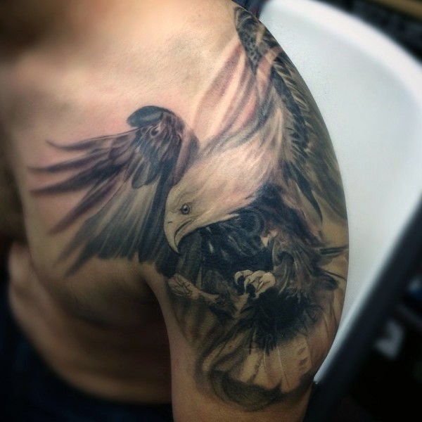 Magnificent detailed and colored flying eagle tattoo on shoulder