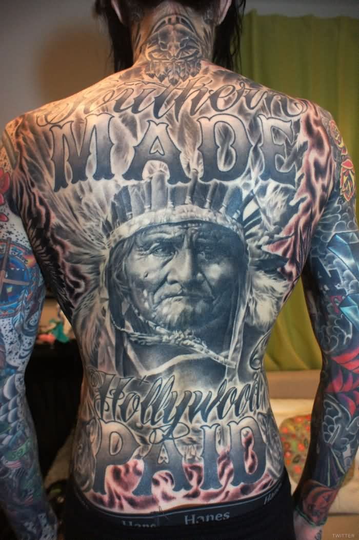 Magnificent massive very detailed old Indian portrait tattoo on whole back stylized with lettering