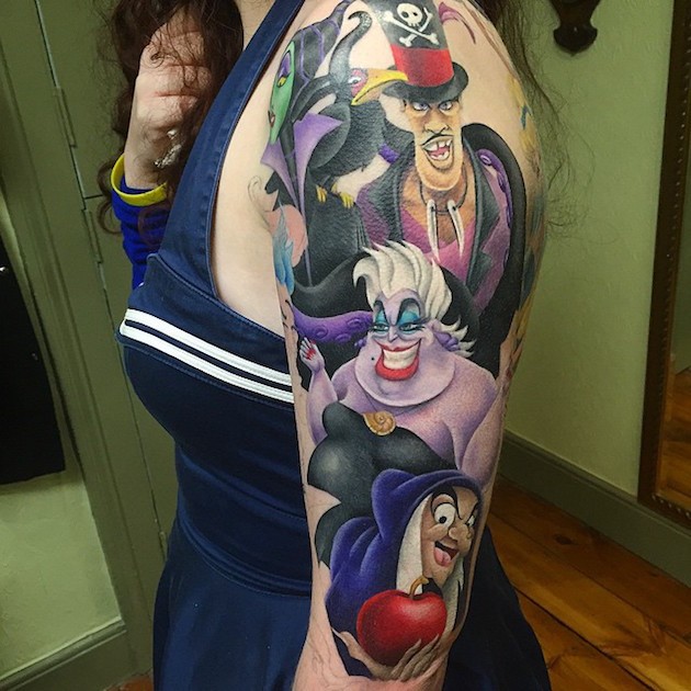 Magnificent multicolored shoulder tattoo of various cartoons villains
