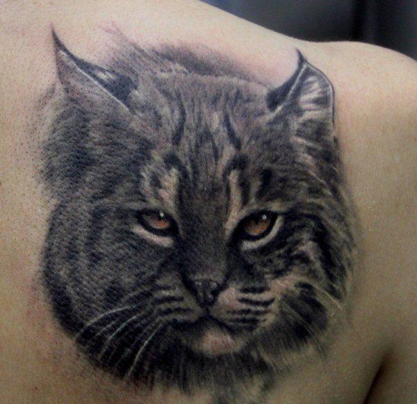 Magnificent painted and detailed black ink wild cat tattoo on shoulder