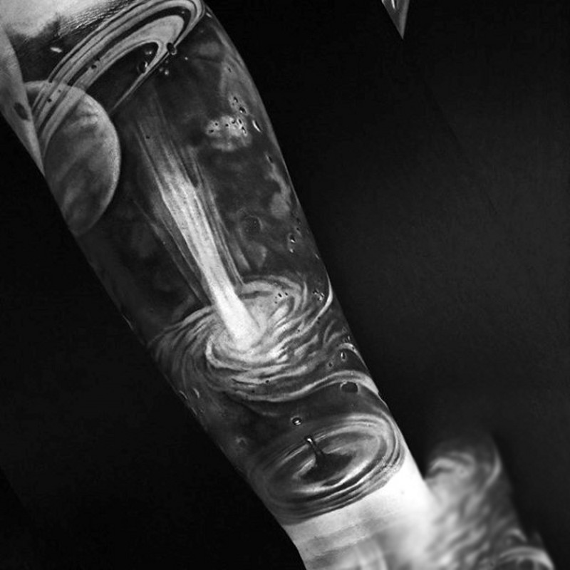 Magnificent painted black and white detailed big blast in space tattoo on sleeve