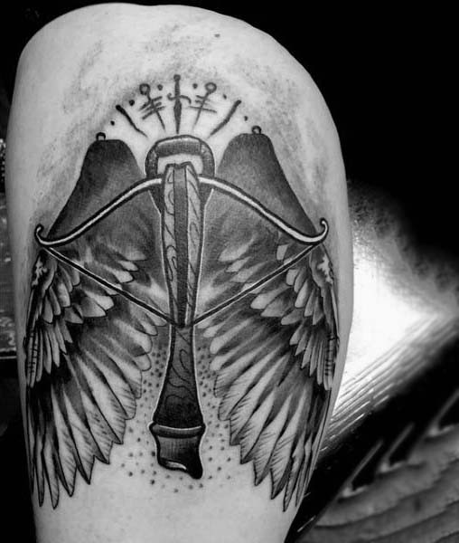 Magnificent painted crossbow with wings tattoo on thigh
