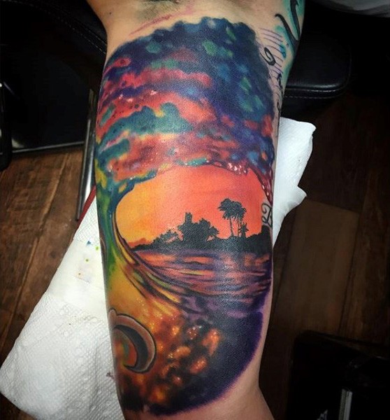 Magnificent painted multicolored wave tattoo on arm