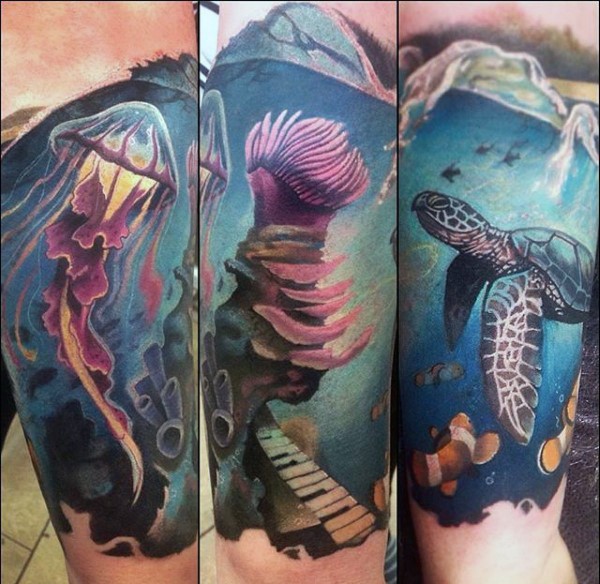 Magnificent painted very beautiful jellyfish with turtle tattoo on arm