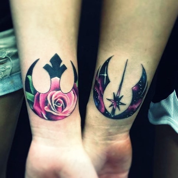Magnificent unusual painted various Star Wars emblems tattoo on forearms with flowers and space