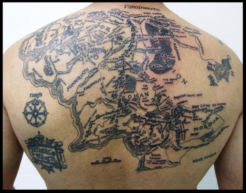 Magnificent very detailed black ink Lord of the rings world map tattoo on back
