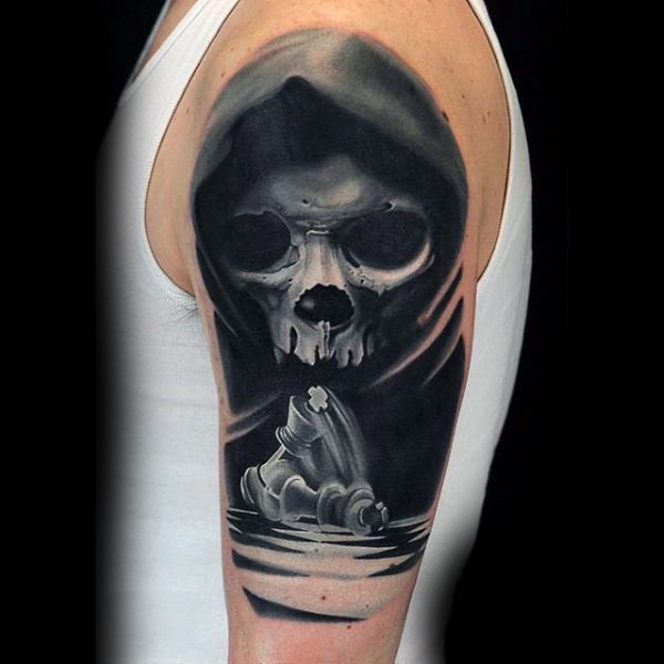 Magnificent very detailed mystic skull with chess figure tattoo on shoulder area