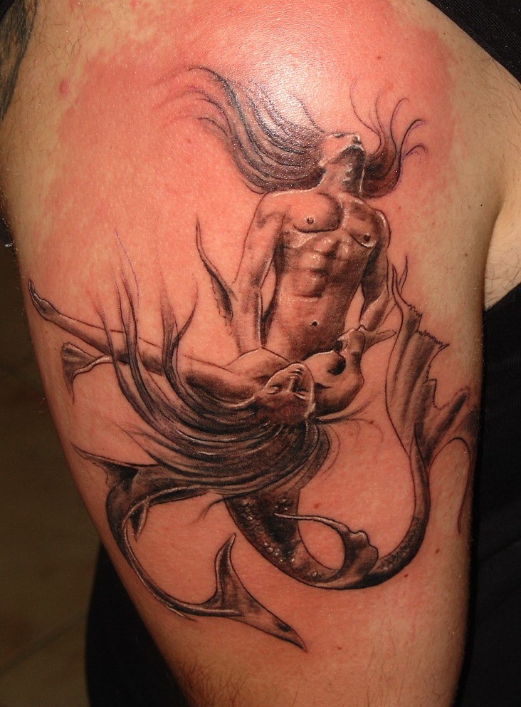 Male and female mermaids making love original idea of shoulder tattoo